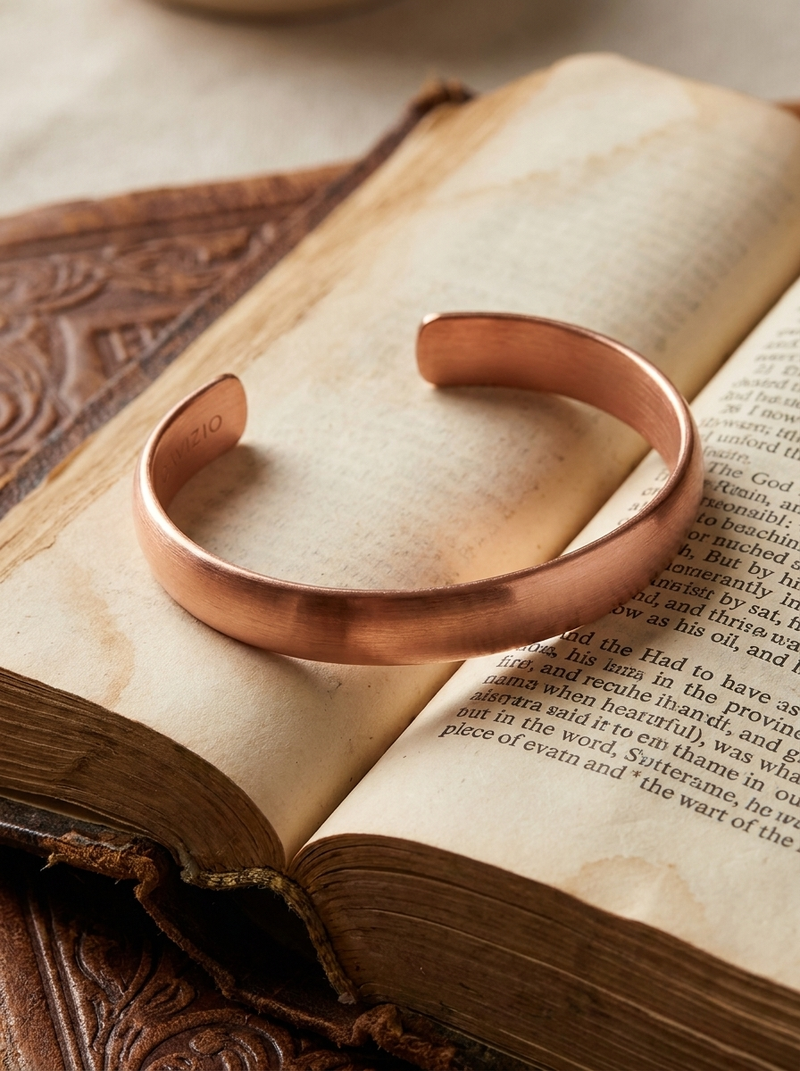 Copper bracelet resting on a Bible